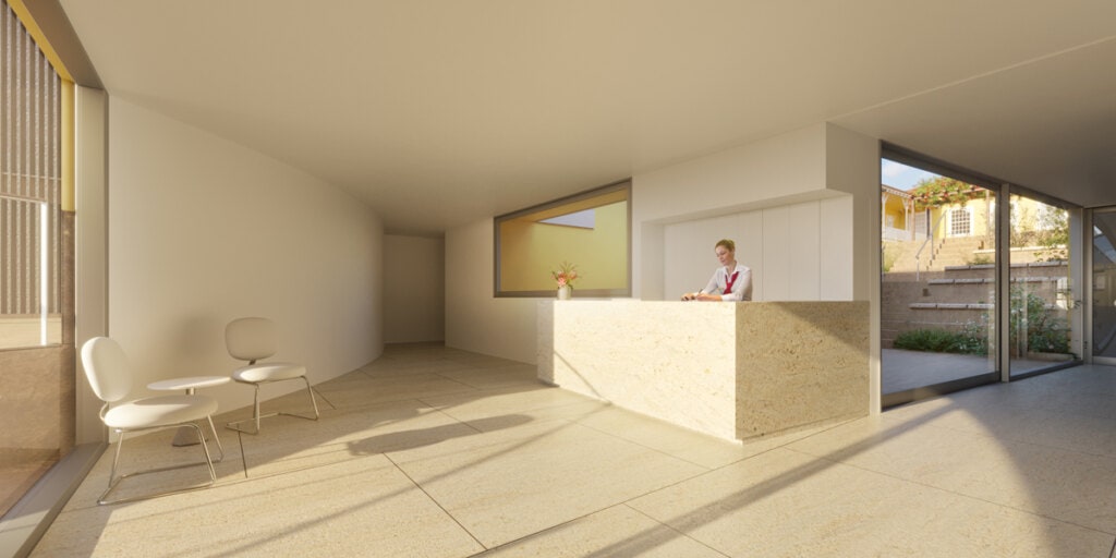 A recepção dá acesso ao salão multiuso e às áreas administrativas. Ao fundo, percebe-se a arquibancada acomodada no desnível do terreno que tem no pátio inferior seu ponto focal. A conexão desembaraçada entre o salão multiuso e o pátio pode vir a ser de grande uso em dias de eventos.