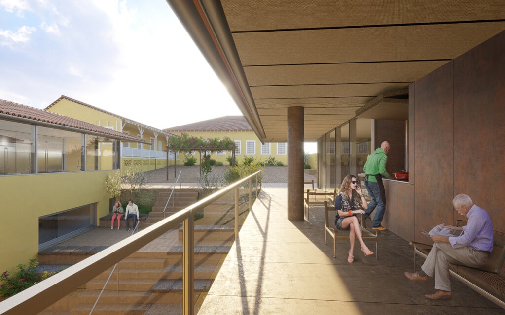 A varanda ampla permite que as pessoas se reúnam ao redor do fogão à lenha e disfrutem da ampla visual para o conjunto arquitetônico e para o paisagismo dos pátios. Os materiais foram selecionados para contribuir para a harmonia do todo.